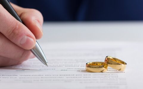 signing-divorce-paper-rings